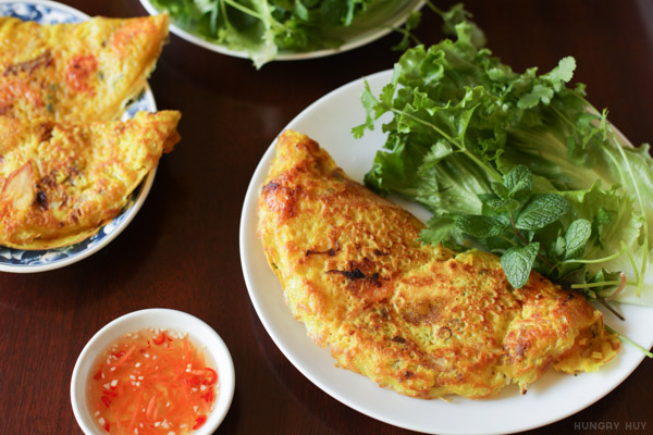 Banh xeo crispy pancake with fish sauce and vegetables