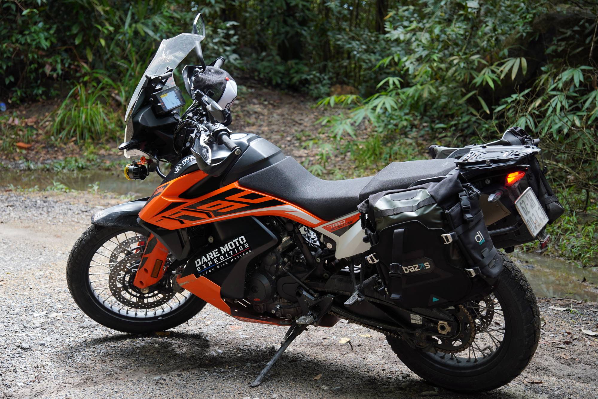DME KTM 790 Adventure with side bags on a forest gravel road