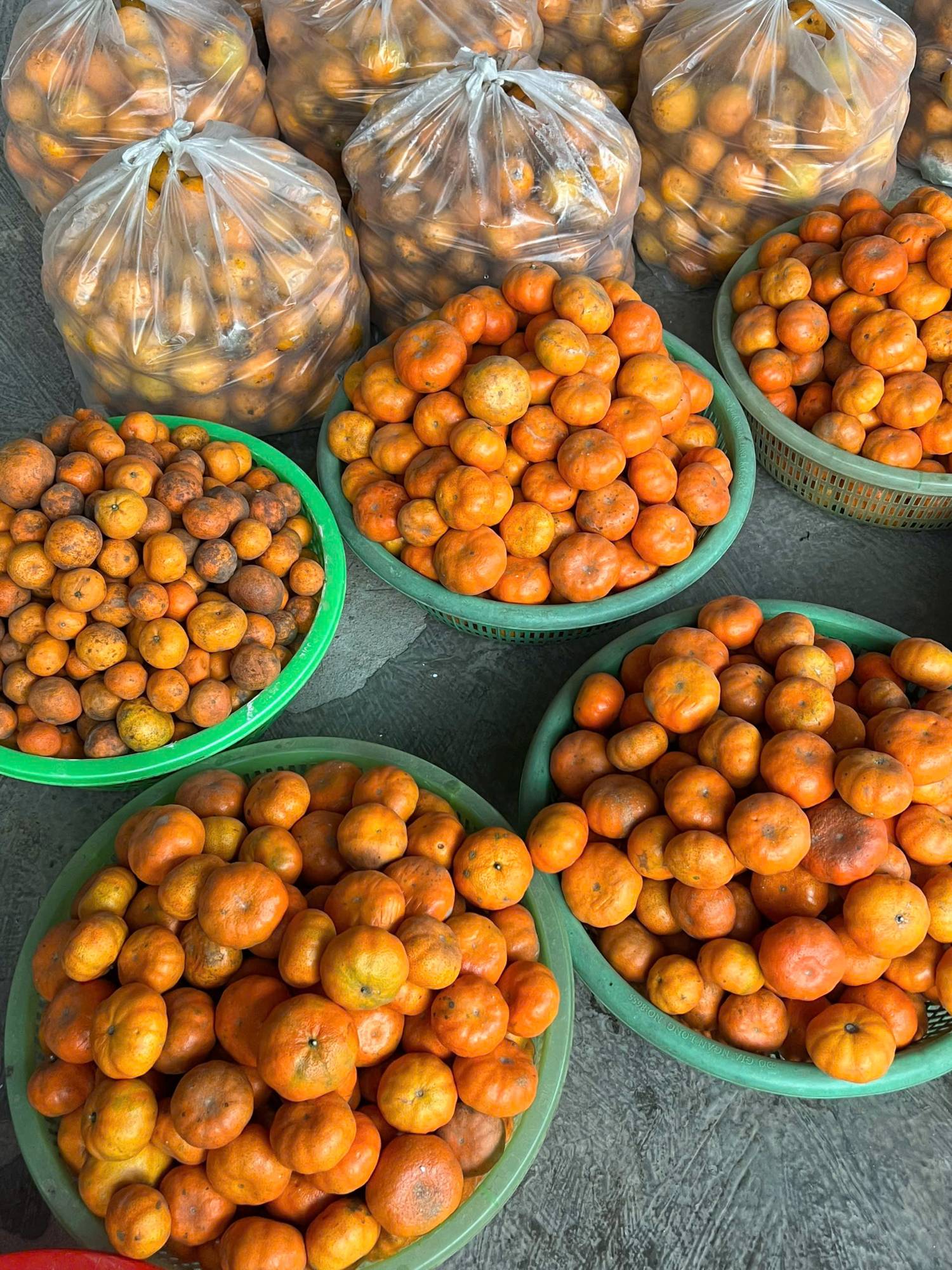 Baskets of local mandarins at a roadside market