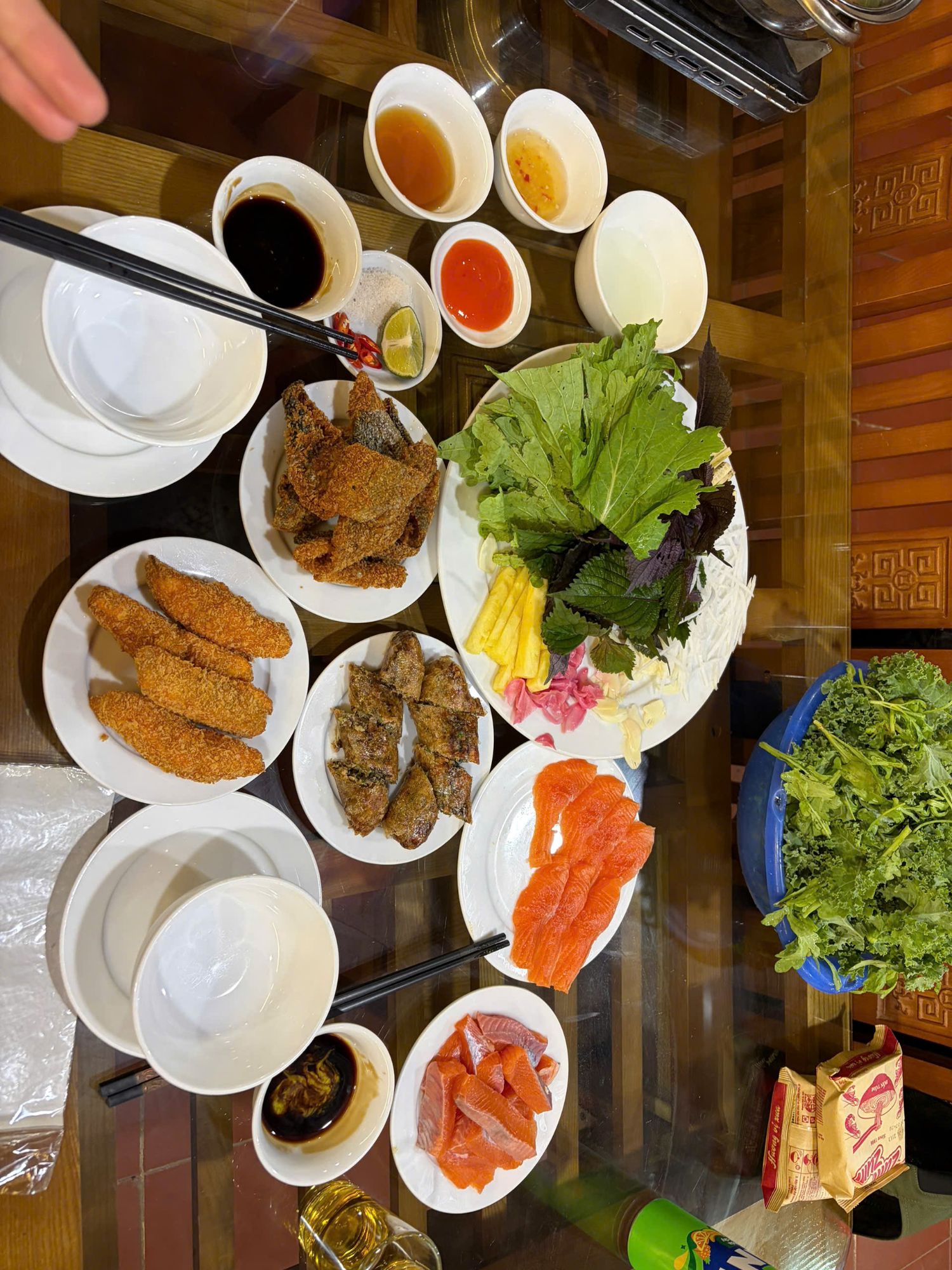 Sa Pa salmon served raw and fried, with herbs and dipping sauces