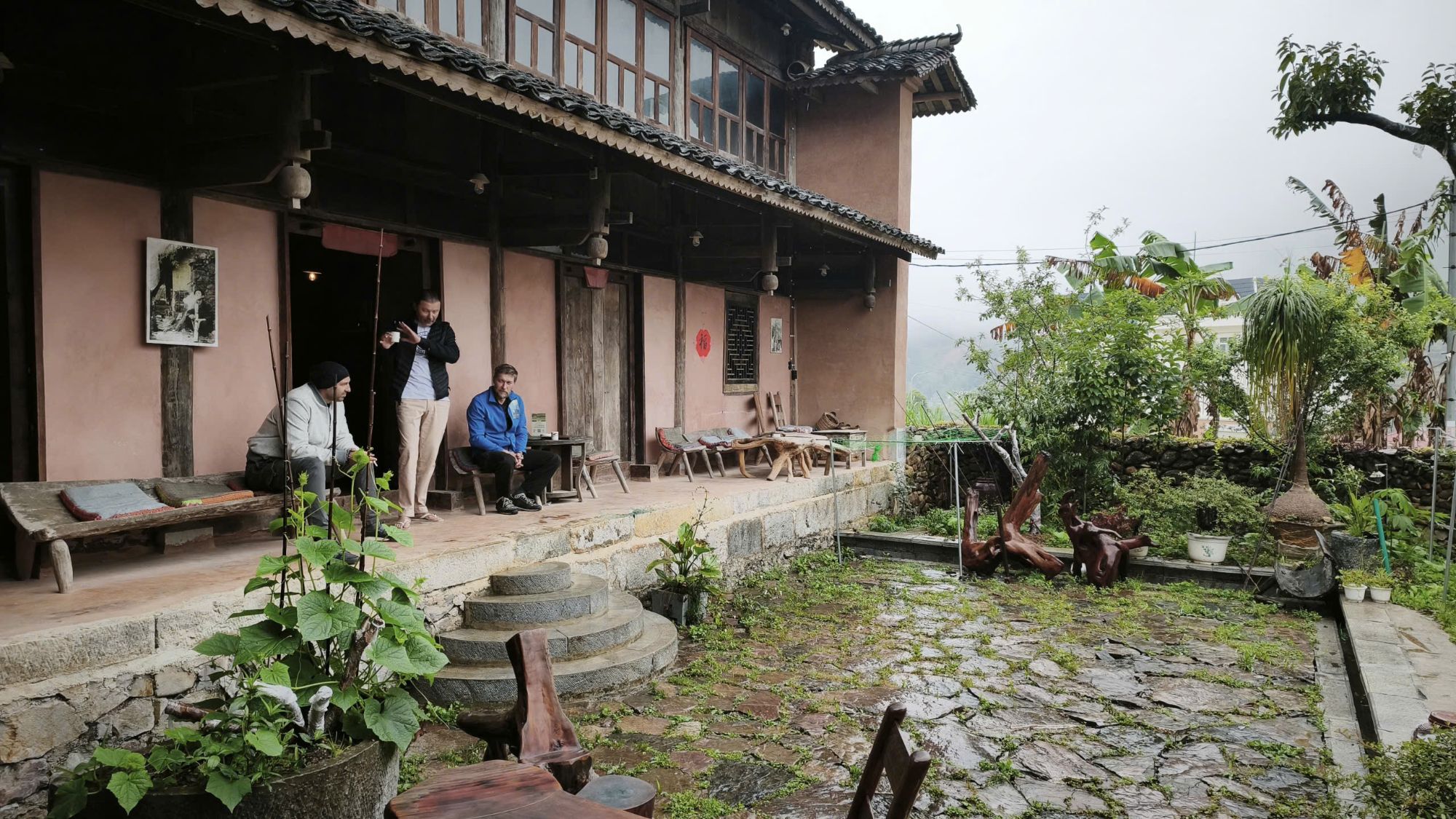 Riders on the porch of a traditional homestay
