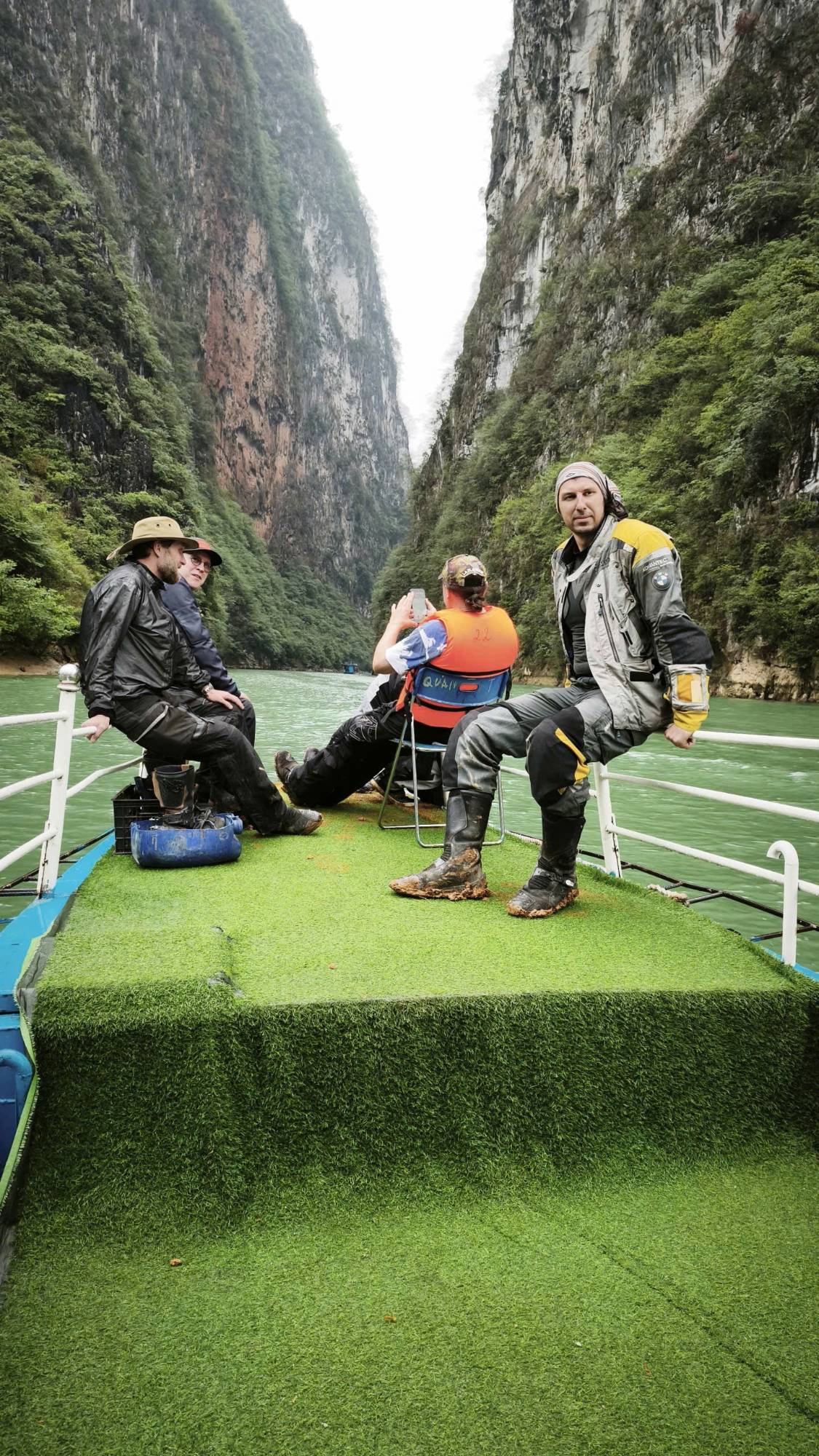 Riders on a boat through a steep river gorge